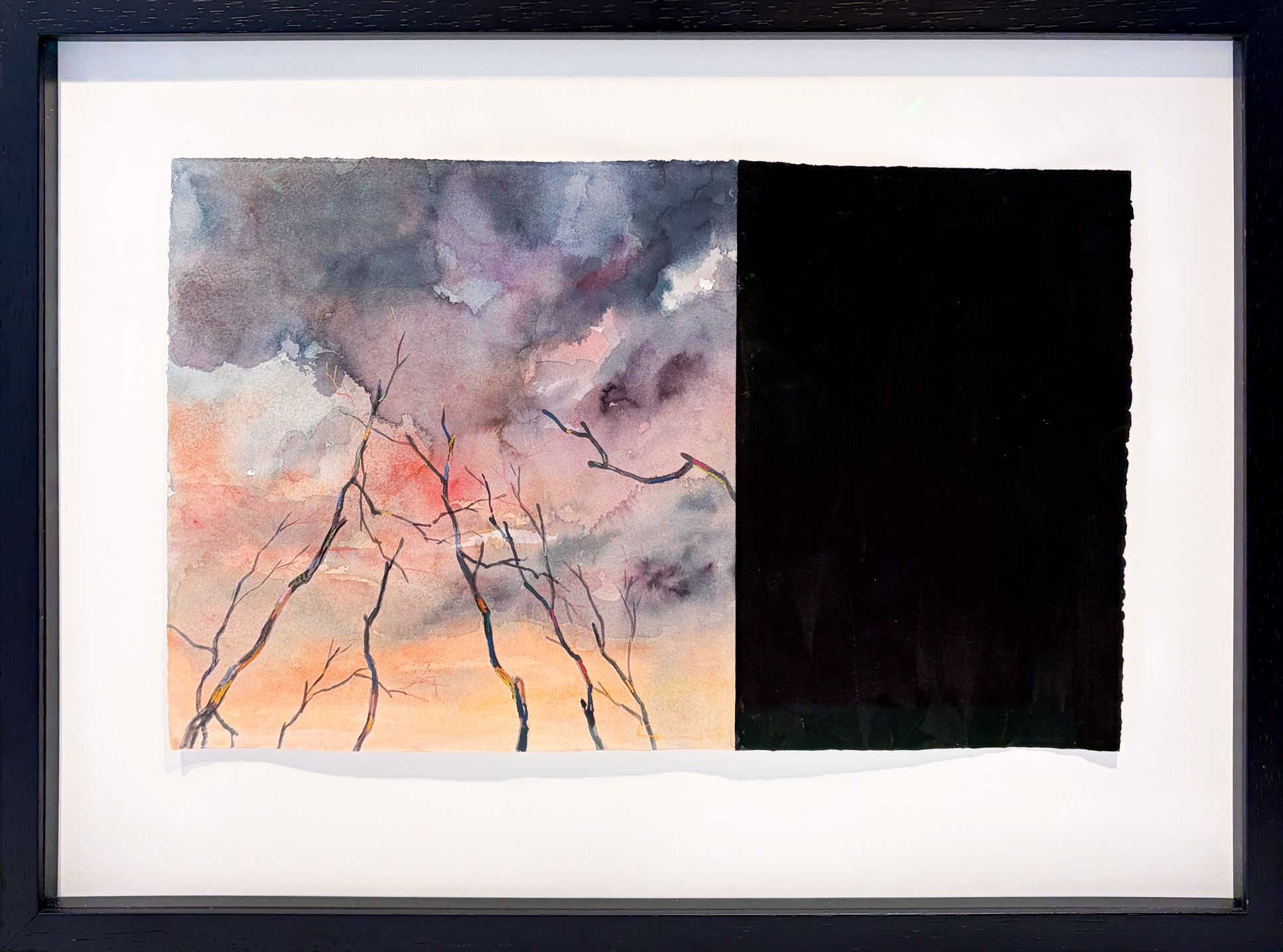 Watercolor from 2022 featuring bare tree branches against a colored sky and a large black surface on the right, 29 x 46 cm.